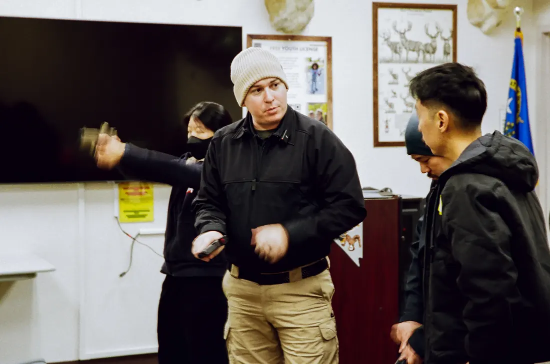 An instructor explaining a concept to a small classroom group